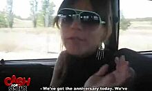 Exotic woman in sunglasses performs in car
