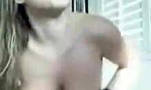 Big-boobed teen with navel piercing teases her huge tits intensely