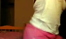 Exotic ebony woman dances and poses in shorts on webcam, showcasing her fabulous designer outfit.