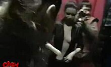 Brunette in glasses films herself getting fingered on bed