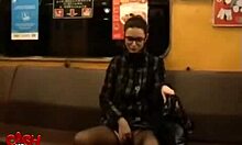 Brunette in glasses films herself getting fingered on bed