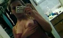 Naughty teen with natural tits undresses in mirror for solo show