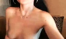 The inviting gal in black lingerie spreads her legs and rubs her moist pussy with a dildo