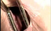 I am the marvelous vixen gently playing with my asshole using anal toys and speculum