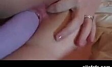 Wow, Check This Inked Bimbo Sucking a Massive Purple Dildo!