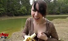 Punky teen flashes outdoors and plays with banana