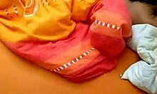 Playful brunette girlfriend masturbates on bed