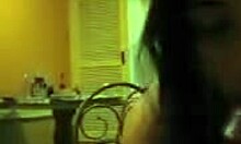 Darkish Doll Making Eye Contact While Enjoying Homemade Fun