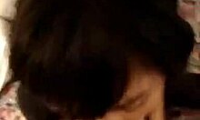 Asian hottie kneels down, fear in her eyes, sucking hard on a thick penis.