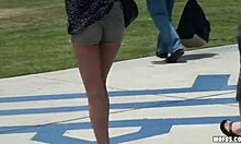 Wicked black-haired bimbo showing her upskirt in the public