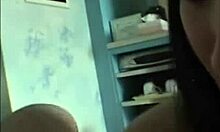 Short-haired Asian brunette sucks cock on her knees