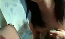 Short-haired Asian brunette sucks cock on her knees