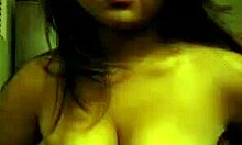 Oriental Teen Undresses and Plays with Small Tits