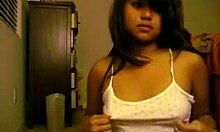 Oriental Teen Undresses and Plays with Small Tits