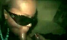 Stylish ebony babe performs oral while smoking