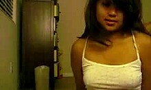 Oriental Teen Undresses and Plays with Small Tits