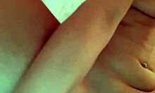 Attractive woman using toys in her bedroom