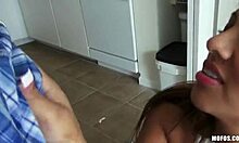 I watch her get naked in kitchen before sucking my cock