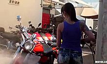 This bitch in jeans shorts washes bikes before getting fingered POV