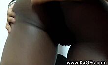 Pierced kinky ebony woman starts stroking her pierced vagina with detailed movements