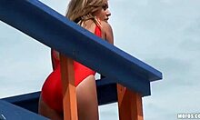 baywatch babe checks for drowning while fucking on beach