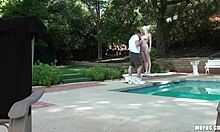 A guy films an amateur foursome by the pool, watching the girls suck and fuck in doggystyle.