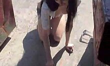 Girl With Stylish Hat Pees Between Trash Cans