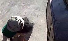 Girl With Stylish Hat Pees Between Trash Cans