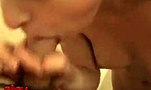 this skinny lad is being jerked off by a horny hooker, sucking her tits