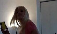 Very pale girl takes photos of her body in the mirror