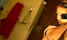 Blonde gal masturbates her shaved pussy in front of mirror