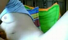 Curious Gal Explores Shaved Pussy on Webcam Bed