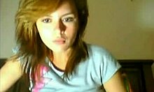 Curious Gal Explores Shaved Pussy on Webcam Bed