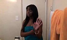 Ebony babe with piercings masturbates in the bathroom close-up.