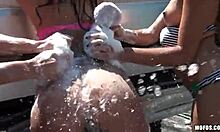 Teen girlfriends do sexy car wash fun