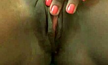 Ebony babe with piercings masturbates in the bathroom close-up.