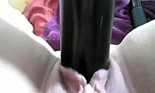 Lovely raunchy bimbo tells a steamy story while banging herself with a big dildo