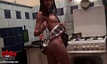 Brown-Haired Maid Prepares Meal in Kitchen Before Work