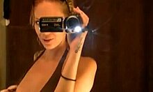 Blonde gal masturbates her shaved pussy in front of mirror