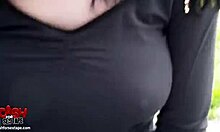 Attractive brunette with great body poses in doggystyle position outdoors.