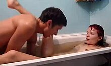 Red-haired slut screams loud while getting pounded hard in bathtub.