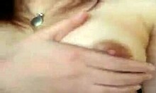 Asian woman spreads firm tits for webcam masturbation