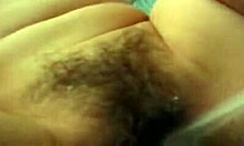 Asian woman spreads firm tits for webcam masturbation