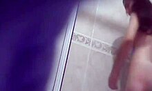 brown-haired cutie inspecting her big boobies while standing in bathroom