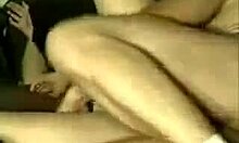 a woman lies in bed touching herself gently