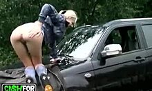 Sexy blonde bombshell poses on car before outdoor sex?