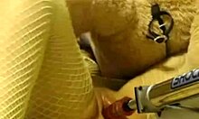 Watch this nerdy brunette in fishnets get fucked by a machine? She's loving it!