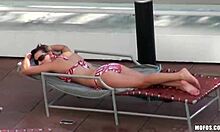 Brown-haired gal masturbates hard on bed edge