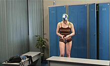 blond-haired babe reveals long legs in voyeur striptease