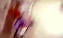 cheerful gal proudly displaying her cute features in the mirror